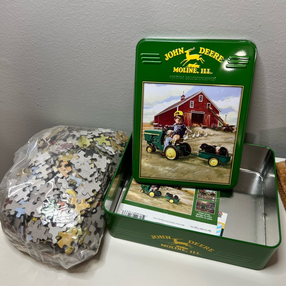 John Deere puzzle with collectors metal tin.